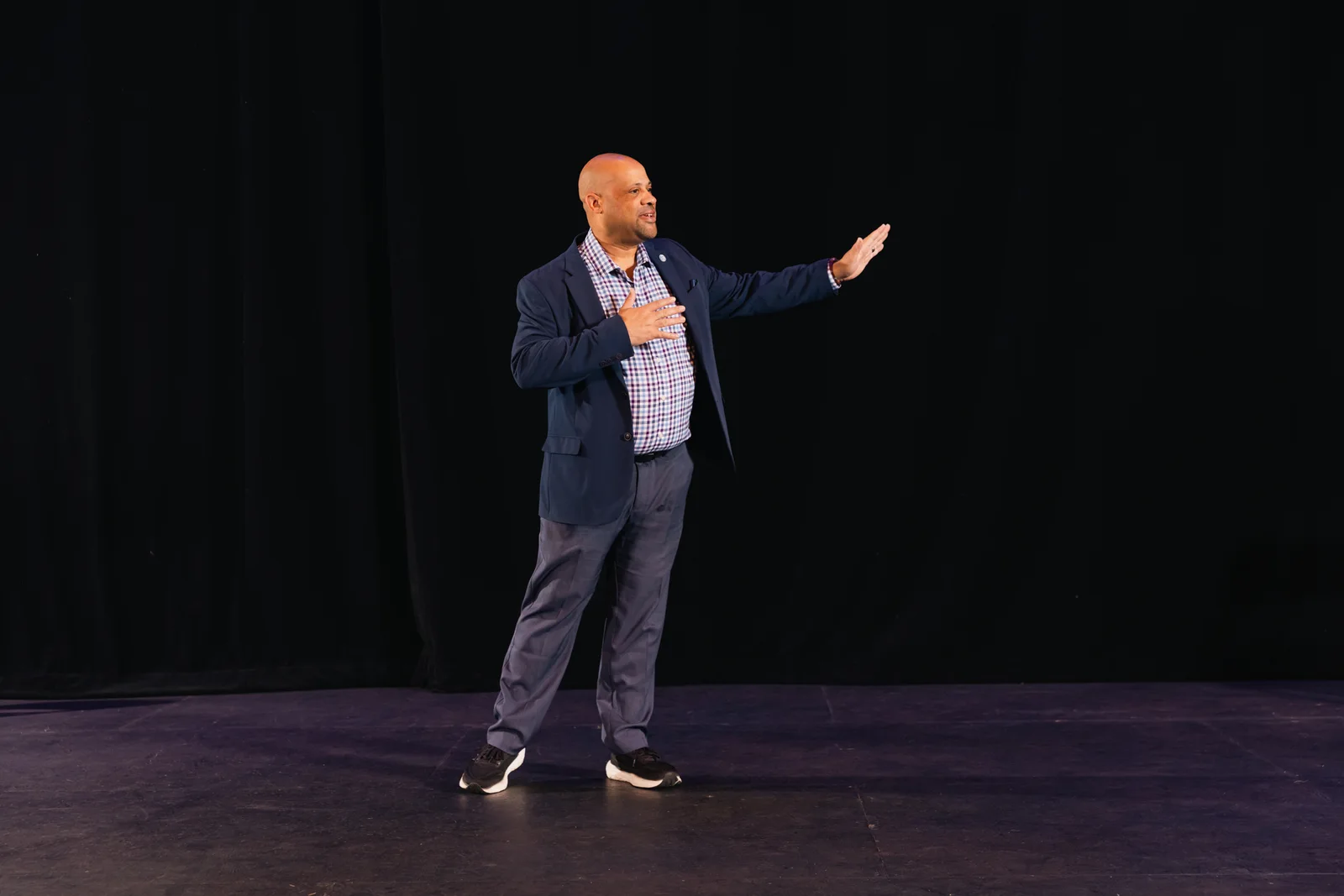Mike Roberts speaking on stage